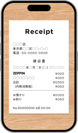 レシートをスマートフォンで真上から撮影しているイメージ